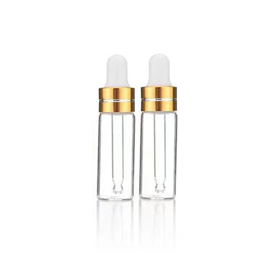 Bouteille d'huile essentielle en verre clair avec gouttelier en aluminium