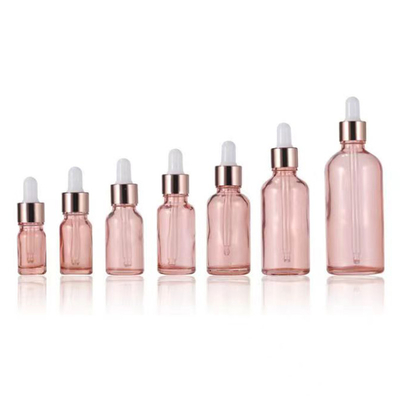 Bouteille essentielle en verre rose en gros avec bouchon de gouttelette en aluminium doré